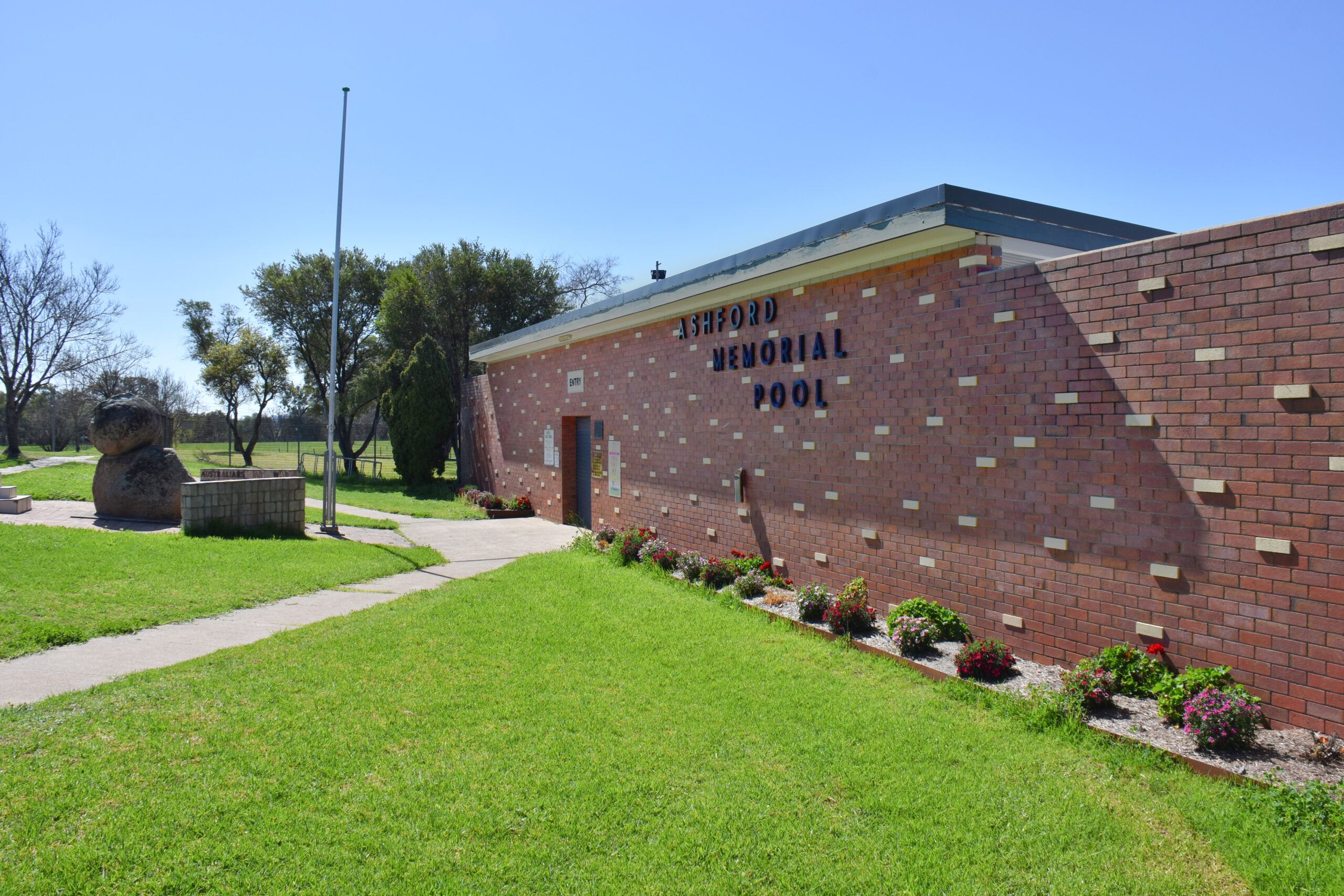 Exterior shot of the Ashford Swimming Pool brick building
